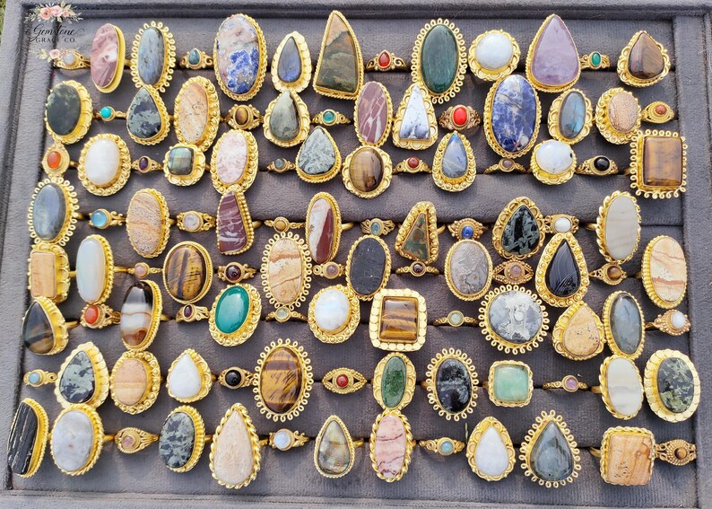 Assorted natural gemstone gold plated rings, wholesale gemstone ring lot, bulk boho rings for resale, handmade crystal rings collection, gold plated brass rings women, mixed stone ring assortment, boutique jewelry supplier rings, bohemian stacking rings set, minimalist gemstone rings bulk, adjustable gold rings wholesale, mothers day gift rings set, spiritual crystal jewelry lot, reseller jewelry bulk pack, artisan handmade ring mix, trendy boho gift jewelry