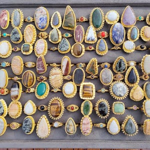 Assorted natural gemstone gold plated rings, wholesale gemstone ring lot, bulk boho rings for resale, handmade crystal rings collection, gold plated brass rings women, mixed stone ring assortment, boutique jewelry supplier rings, bohemian stacking rings set, minimalist gemstone rings bulk, adjustable gold rings wholesale, mothers day gift rings set, spiritual crystal jewelry lot, reseller jewelry bulk pack, artisan handmade ring mix, trendy boho gift jewelry