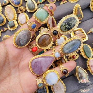 Assorted natural gemstone gold plated rings, wholesale gemstone ring lot, bulk boho rings for resale, handmade crystal rings collection, gold plated brass rings women, mixed stone ring assortment, boutique jewelry supplier rings, bohemian stacking rings set, minimalist gemstone rings bulk, adjustable gold rings wholesale, mothers day gift rings set, spiritual crystal jewelry lot, reseller jewelry bulk pack, artisan handmade ring mix, trendy boho gift jewelry