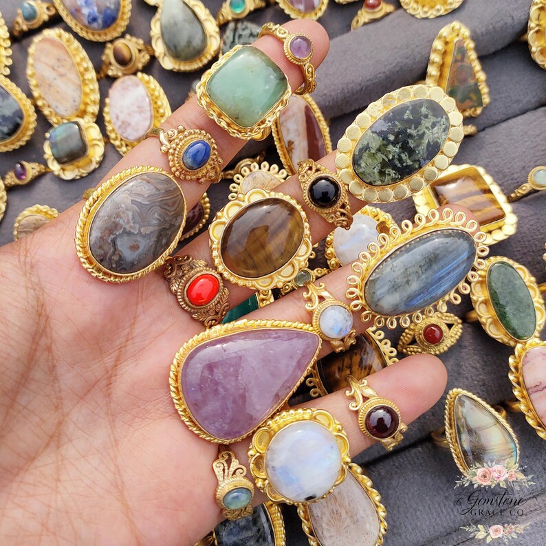 Assorted natural gemstone gold plated rings, wholesale gemstone ring lot, bulk boho rings for resale, handmade crystal rings collection, gold plated brass rings women, mixed stone ring assortment, boutique jewelry supplier rings, bohemian stacking rings set, minimalist gemstone rings bulk, adjustable gold rings wholesale, mothers day gift rings set, spiritual crystal jewelry lot, reseller jewelry bulk pack, artisan handmade ring mix, trendy boho gift jewelry