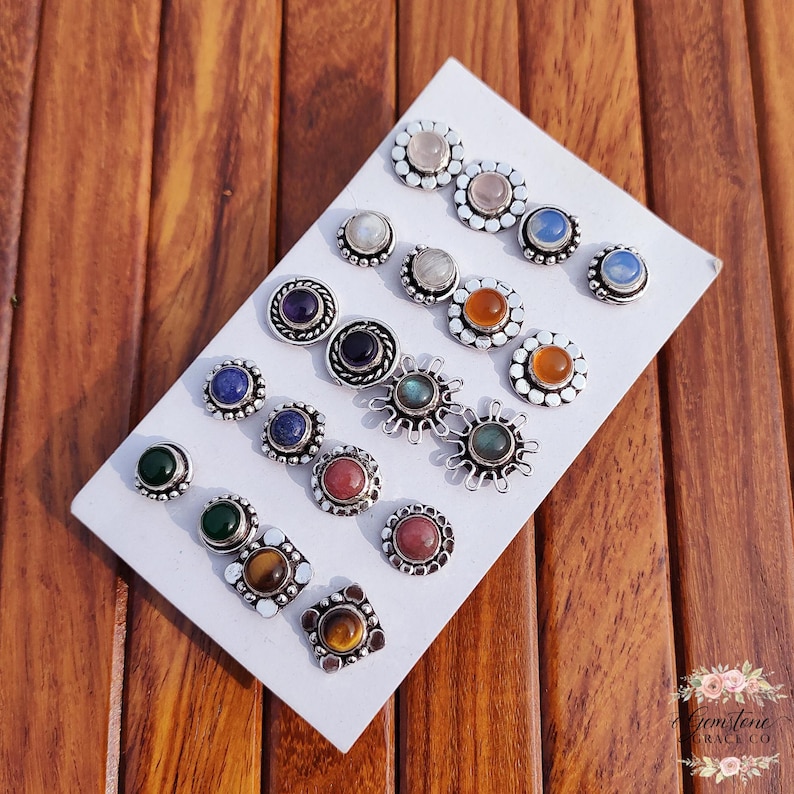 Wholesale mix gemstone stud earrings displayed on card, featuring assorted natural stones including moonstone, labradorite, amethyst, lapis lazuli, tiger eye, green onyx and carnelian. Handmade silver plated stud earrings with brass base metal, mixed designs and shapes. Bulk gemstone stud earrings for jewelry resellers, boutiques, birthstone collections, boho jewelry shops, crystal lovers and wholesale jewelry supply businesses.