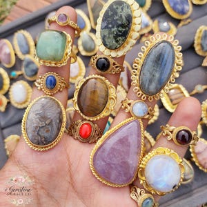 Assorted natural gemstone gold plated rings, wholesale gemstone ring lot, bulk boho rings for resale, handmade crystal rings collection, gold plated brass rings women, mixed stone ring assortment, boutique jewelry supplier rings, bohemian stacking rings set, minimalist gemstone rings bulk, adjustable gold rings wholesale, mothers day gift rings set, spiritual crystal jewelry lot, reseller jewelry bulk pack, artisan handmade ring mix, trendy boho gift jewelry