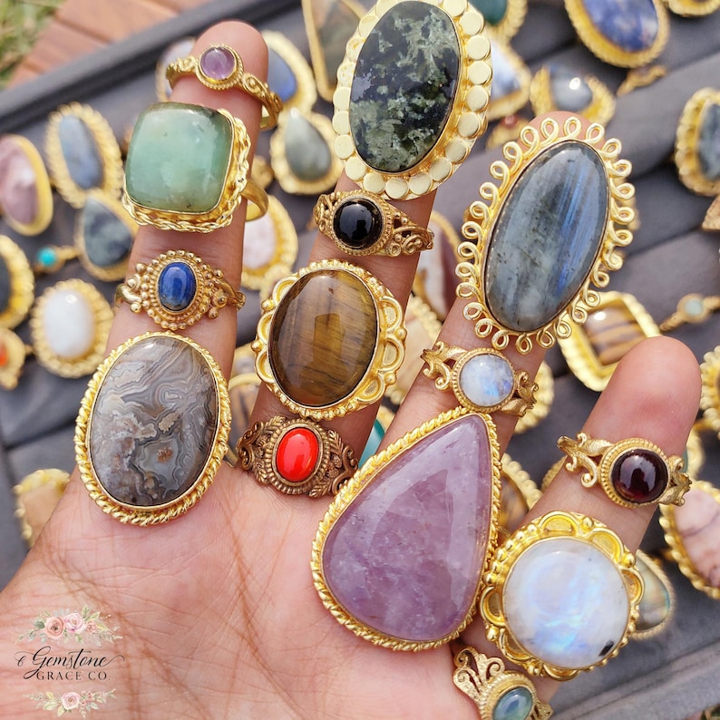 Assorted natural gemstone gold plated rings, wholesale gemstone ring lot, bulk boho rings for resale, handmade crystal rings collection, gold plated brass rings women, mixed stone ring assortment, boutique jewelry supplier rings, bohemian stacking rings set, minimalist gemstone rings bulk, adjustable gold rings wholesale, mothers day gift rings set, spiritual crystal jewelry lot, reseller jewelry bulk pack, artisan handmade ring mix, trendy boho gift jewelry