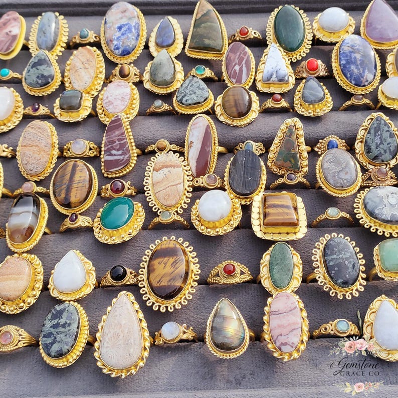 Assorted natural gemstone gold plated rings, wholesale gemstone ring lot, bulk boho rings for resale, handmade crystal rings collection, gold plated brass rings women, mixed stone ring assortment, boutique jewelry supplier rings, bohemian stacking rings set, minimalist gemstone rings bulk, adjustable gold rings wholesale, mothers day gift rings set, spiritual crystal jewelry lot, reseller jewelry bulk pack, artisan handmade ring mix, trendy boho gift jewelry