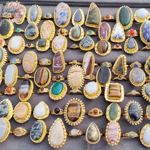 Assorted natural gemstone gold plated rings, wholesale gemstone ring lot, bulk boho rings for resale, handmade crystal rings collection, gold plated brass rings women, mixed stone ring assortment, boutique jewelry supplier rings, bohemian stacking rings set, minimalist gemstone rings bulk, adjustable gold rings wholesale, mothers day gift rings set, spiritual crystal jewelry lot, reseller jewelry bulk pack, artisan handmade ring mix, trendy boho gift jewelry