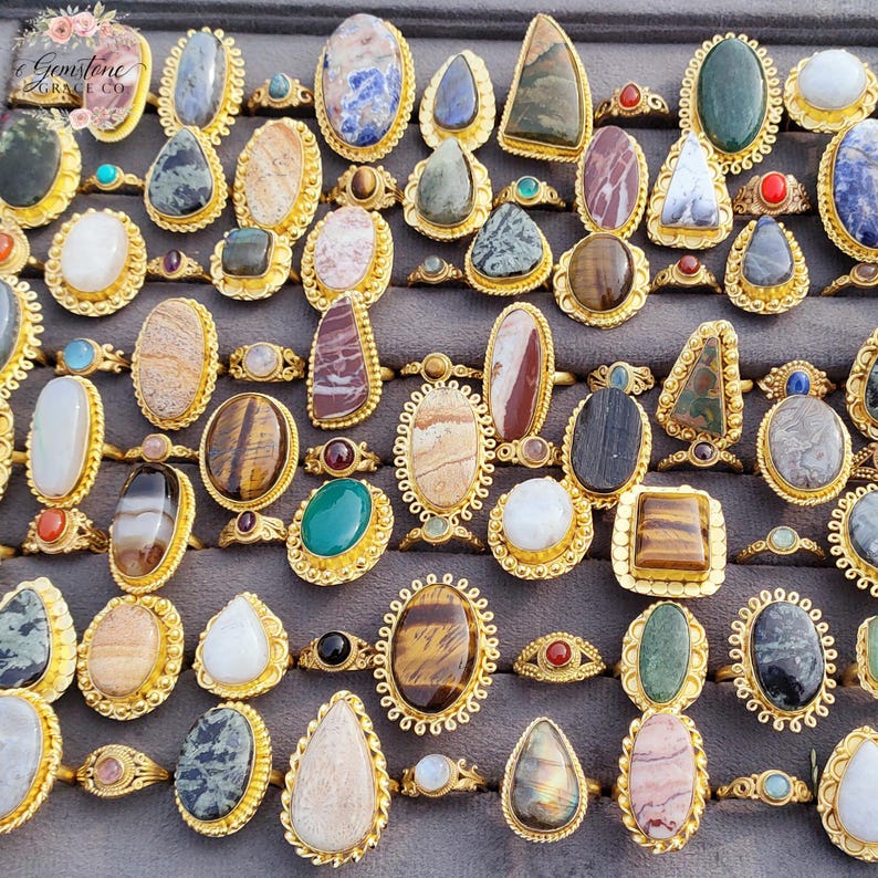 Assorted natural gemstone gold plated rings, wholesale gemstone ring lot, bulk boho rings for resale, handmade crystal rings collection, gold plated brass rings women, mixed stone ring assortment, boutique jewelry supplier rings, bohemian stacking rings set, minimalist gemstone rings bulk, adjustable gold rings wholesale, mothers day gift rings set, spiritual crystal jewelry lot, reseller jewelry bulk pack, artisan handmade ring mix, trendy boho gift jewelry