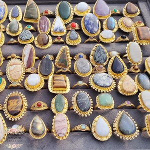 Assorted natural gemstone gold plated rings, wholesale gemstone ring lot, bulk boho rings for resale, handmade crystal rings collection, gold plated brass rings women, mixed stone ring assortment, boutique jewelry supplier rings, bohemian stacking rings set, minimalist gemstone rings bulk, adjustable gold rings wholesale, mothers day gift rings set, spiritual crystal jewelry lot, reseller jewelry bulk pack, artisan handmade ring mix, trendy boho gift jewelry