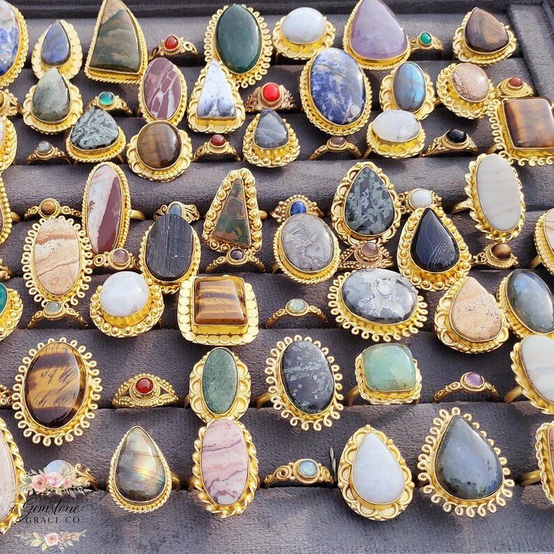 Assorted natural gemstone gold plated rings, wholesale gemstone ring lot, bulk boho rings for resale, handmade crystal rings collection, gold plated brass rings women, mixed stone ring assortment, boutique jewelry supplier rings, bohemian stacking rings set, minimalist gemstone rings bulk, adjustable gold rings wholesale, mothers day gift rings set, spiritual crystal jewelry lot, reseller jewelry bulk pack, artisan handmade ring mix, trendy boho gift jewelry