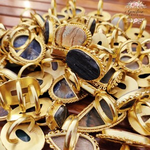 Assorted natural gemstone gold plated rings, wholesale gemstone ring lot, bulk boho rings for resale, handmade crystal rings collection, gold plated brass rings women, mixed stone ring assortment, boutique jewelry supplier rings, bohemian stacking rings set, minimalist gemstone rings bulk, adjustable gold rings wholesale, mothers day gift rings set, spiritual crystal jewelry lot, reseller jewelry bulk pack, artisan handmade ring mix, trendy boho gift jewelry