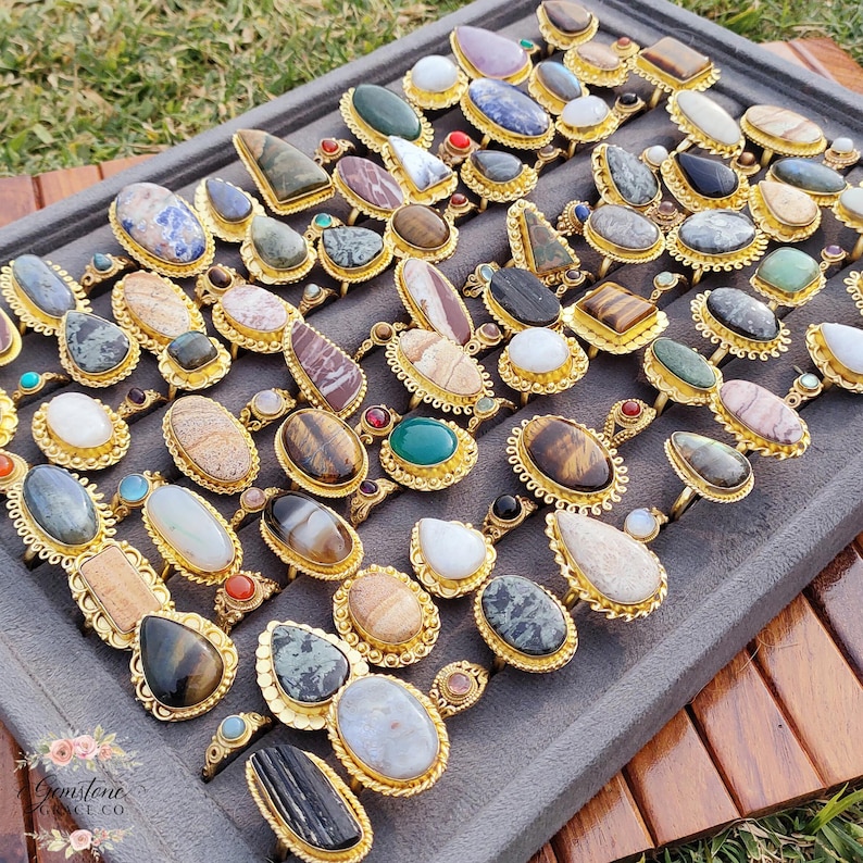 Assorted natural gemstone gold plated rings, wholesale gemstone ring lot, bulk boho rings for resale, handmade crystal rings collection, gold plated brass rings women, mixed stone ring assortment, boutique jewelry supplier rings, bohemian stacking rings set, minimalist gemstone rings bulk, adjustable gold rings wholesale, mothers day gift rings set, spiritual crystal jewelry lot, reseller jewelry bulk pack, artisan handmade ring mix, trendy boho gift jewelry