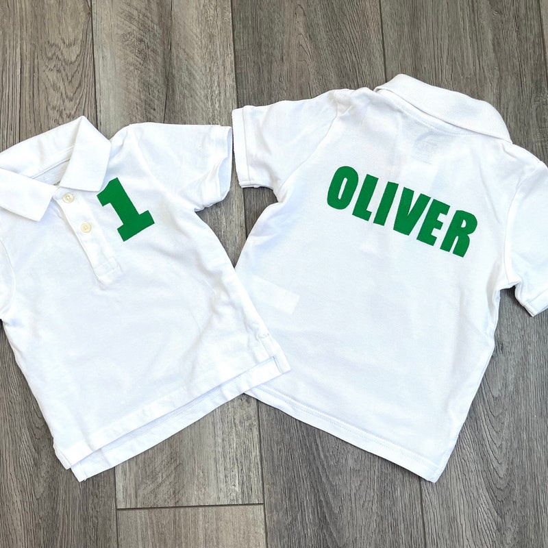 Front and back -Boy, girl, toddler white  polo golf SHIRT with birthday number, personalized on back in green, golf caddy