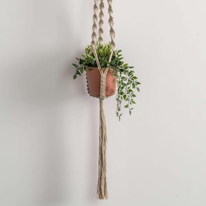 May include: A rustic wooden sign with the text "Welcome to our home" in white lettering. The sign features a distressed finish and a simple, inviting design, perfect for entryway decor.