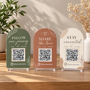 May include: Three arched acrylic signs with QR codes and social media icons. The green sign reads FOLLOW our journey, the terracotta sign reads SHARE the love, and the cream sign reads STAY connected. Each includes SCAN LIKE FOLLOW text.
