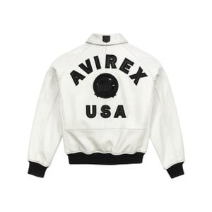 May include: White leather jacket with black ribbed cuffs and collar. The back features the embroidered text "AVIREX USA" above a circular emblem. A classic bomber jacket style.