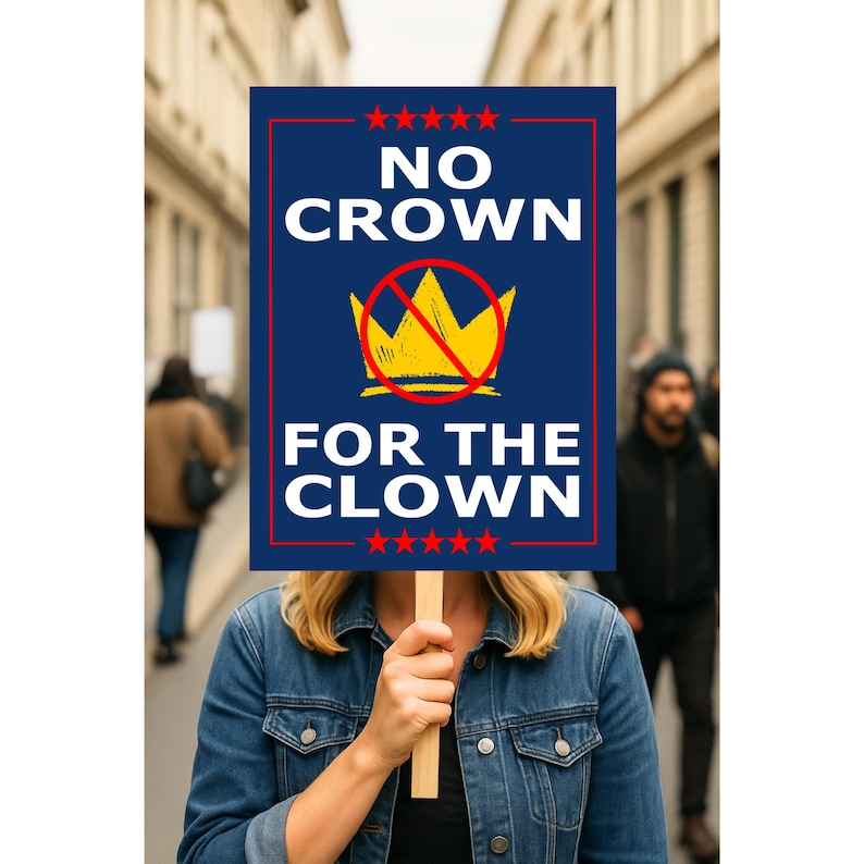 May include: A person holding a sign with the text "NO CROWN FOR THE CLOWN". The sign is blue with white text and a yellow crown with a red slash through it. The sign is framed in red and has red stars at the top and bottom.