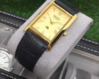 Vintage Seiko Tank Watch: Golden Roman Dial, Black Leather Strap, Wrist Watch