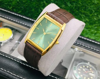 Vintage Seiko Barrel Tank Watch: Green & Golden Dial, Brown Leather Strap, Wrist Watch