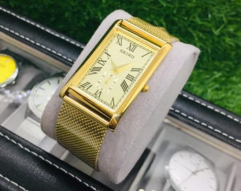 Vintage Seiko Tank Watch: Golden Roman Numeral Dial, Shaffer Bracelet