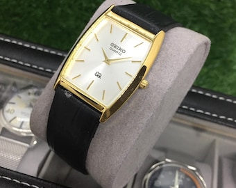 Vintage Seiko Tank Watch: Quartz, Golden Bezel, Black Leather Strap