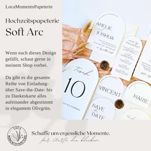 May include: White wedding stationery with black text, including invitations, table numbers, and place cards. The design features an arched shape and is accented with wax seals and dried flowers. The text includes "Amelie and Joshua" and "Save the Date."