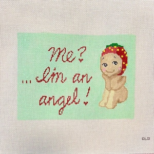May include: Needlepoint canvas featuring a whimsical angel design. The angel, with a red and yellow head covering, is positioned next to a green rectangle with the text "Me? ... I'm an angel!" in red script. The background is a white grid.