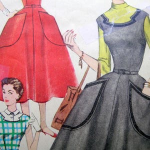 May include: Vintage fashion illustration featuring three women's dresses. One dress is red with pockets, another is gray with a yellow top, and the third is blue and green checkered. The illustration has a retro style.