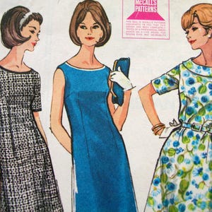 May include: Vintage McCall's Patterns illustration featuring three women in dresses. The dresses include a black and white patterned dress, a solid blue dress, and a floral print dress. The image includes the text "McCall's Patterns".