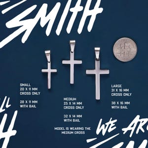 May include: Three silver cross pendants of different sizes. The smallest cross is 20 mm by 11 mm, the medium cross is 25 mm by 14 mm, and the largest cross is 31 mm by 16 mm. The text "SMALL", "MEDIUM", and "LARGE" is displayed below each cross, along with the dimensions of each cross. The text "CROSS ONLY" is displayed below the small and large crosses. The text "WITH BAIL" is displayed below the medium and large crosses. The text "MODEL IS WEARING THE MEDIUM CROSS" is displayed below the crosses.