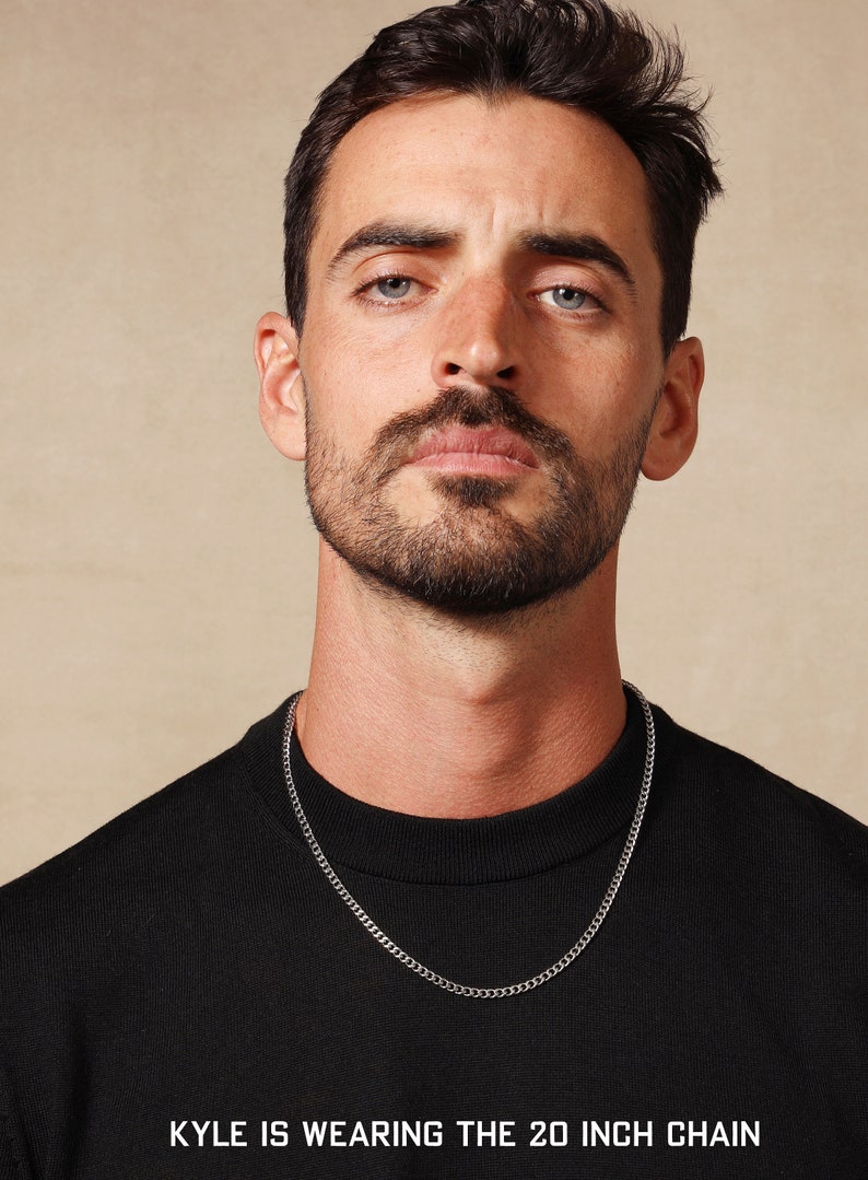 May include: A man wearing a black t-shirt with a silver chain necklace. The text "KYLE IS WEARING THE 20 INCH CHAIN" is at the bottom of the image.