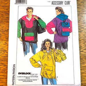 May include: A sewing pattern from The Accessory Club showing illustrations of hooded pullovers with pockets. The pattern is suitable for an Overlock/Serger machine. The pullovers are shown in black, green, pink, purple, and yellow.