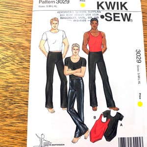 May include: A Kwik Sew sewing pattern, number 3029, showing illustrations of a man in different outfits. These include a white t-shirt, a black t-shirt, and a red vest, all with black trousers. Sizes available are S-M-L-XL.