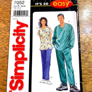 May include: Simplicity pattern 7052 for medical scrubs, showing illustrations of the garments. One design features a floral top and blue trousers, the other a green scrub set. The text "IT'S SO easy" is displayed on the pattern.