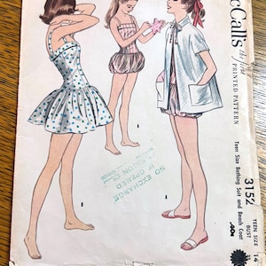 May include: Vintage McCall's printed pattern for a teen-size bathing suit and beach coat. The illustration features three figures in swimwear and beach attire. The pattern includes a bust size of 84 cm. The price is 40 cents.