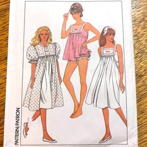 May include: A sewing pattern featuring three different styles of nightgowns. The first nightgown is white with a floral print and has puffed sleeves. The second nightgown is pink and has a lace trim. The third nightgown is white and has a simple design. The pattern includes instructions for making all three nightgowns.