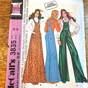 May include: McCall's 3835 sewing pattern showing three jumpsuit designs. The pattern includes a floral print jumpsuit, a blue denim jumpsuit, and a green jumpsuit. The pattern is marked as "Extra Carefree".
