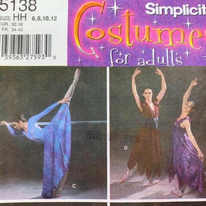 May include: Simplicity pattern number 5138 for adult costumes. The pattern includes instructions for making two different styles of dresses. The first dress is a blue dress with a long skirt and a fitted bodice. The second dress is a purple dress with a long skirt and a fitted bodice. Both dresses are shown on models wearing the dresses and posing in a ballet-like stance.