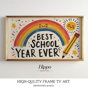 May include: A rectangular framed digital art print featuring a colorful rainbow with a smiling face, a yellow sun with a face, and a yellow pencil. The text reads BEST SCHOOL YEAR EVER in black letters, surrounded by small colorful confetti shapes.