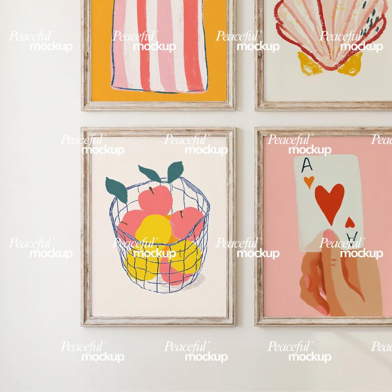 May include: Four framed art prints. One features a basket of pink and yellow fruit, another a playing card with an ace of hearts, and the others have abstract designs. The frames are light wood.