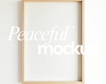 May include: A rectangular wooden picture frame with a white interior, perfect for displaying artwork or photos. The frame has a light brown color and the text "Peaceful mockup" is displayed in white. The number "no.25" is in the bottom left corner.