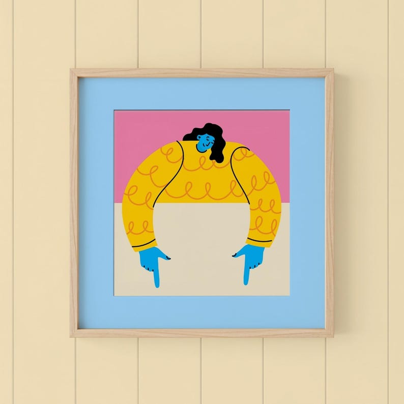 May include: A framed art print featuring a stylized illustration of a person. The figure has blue skin, black hair, and is wearing a yellow sweater. The person's blue hands point downwards. The background is pink and white, framed in blue.