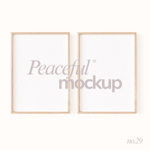 May include: Two rectangular wooden picture frames with white interiors. The frames are light brown and have a simple, clean design. The text "Peaceful mockup" is printed in the center of the frames in a light purple color. The number "no.29" is printed in the bottom right corner.