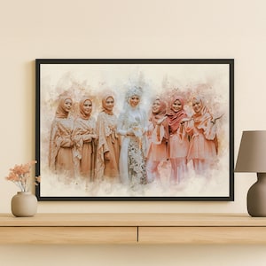 May include: A framed watercolour print showing a group of women in modest, elegant clothing. The women wear headscarves and dresses in peach, beige, and white. The bride is in a white dress with detailed embroidery. The artwork is displayed on a wooden surface.