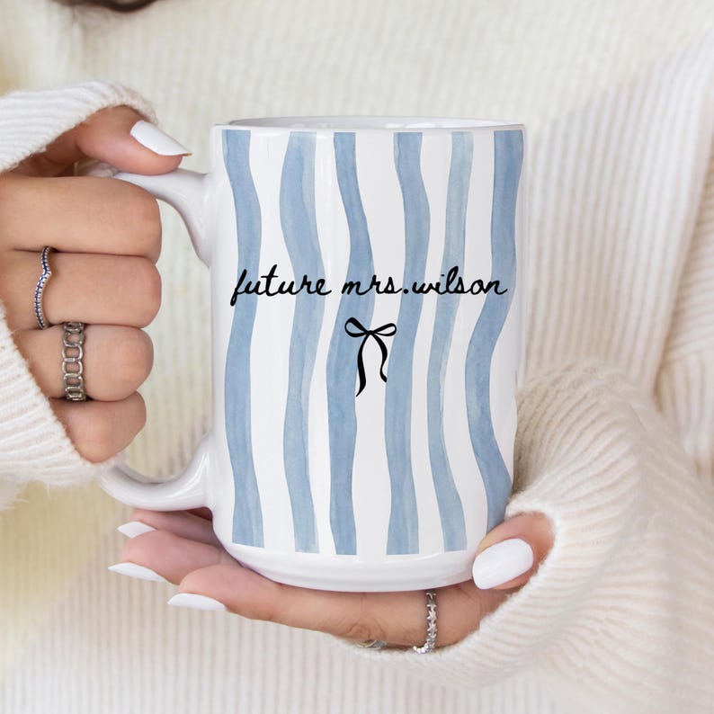 May include: A set of three ceramic mugs with a speckled, matte finish. The mugs are in shades of cream, light gray, and dark gray. Each mug has a simple, minimalist design, perfect for coffee or tea.