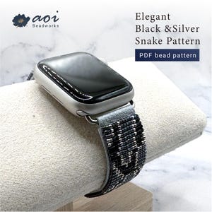 May include: A silver smartwatch with a black screen and a black, silver, and gray beaded band. The band features an elegant snake pattern. Text on the image reads "Elegant Black & Silver Snake Pattern" and "PDF bead pattern".