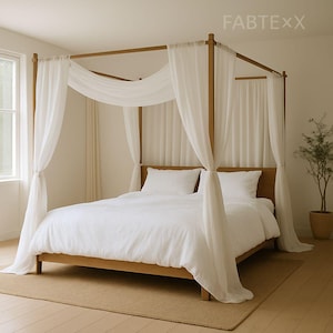May include: A wooden four-poster bed with white bedding and sheer white curtains. The bed frame is a light brown color, and the curtains drape elegantly around the bed. The text "FABTEXX" is visible in the upper right corner.