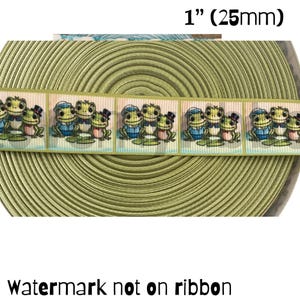 May include: A spool of olive green ribbon with a repeating pattern of cartoon frogs wearing hats and sailor outfits. The ribbon is 1 inch (25mm) wide. Text at the bottom reads "Watermark not on ribbon."