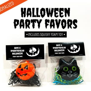 May include: Halloween party favors in clear bags. One bag contains an orange pumpkin squishy toy, the other a black cat squishy toy. Each bag has a black label with the text "Have a Spooktacular Halloween!" and a smiling ghost face.