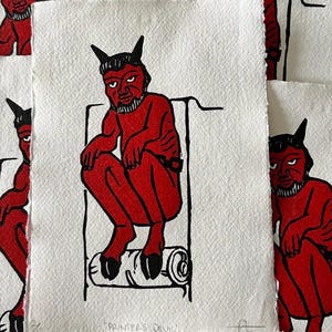 linocut 'printer's devil' printed on handmade paper
