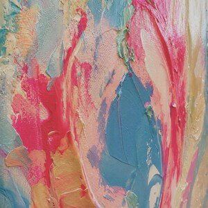 May include: An abstract painting on canvas featuring thick, textured impasto brushstrokes in vibrant shades of hot pink, sky blue, soft peach, and cream. The paint is applied in swirling, layered patterns that create a raised, tactile surface.