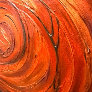 May include: An abstract painting on canvas featuring thick, textured impasto brushstrokes in shades of vibrant orange, deep red, and dark brown. The paint is applied in swirling, circular patterns that create a sense of movement and depth across the surface.